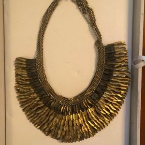 Gold feathered statement